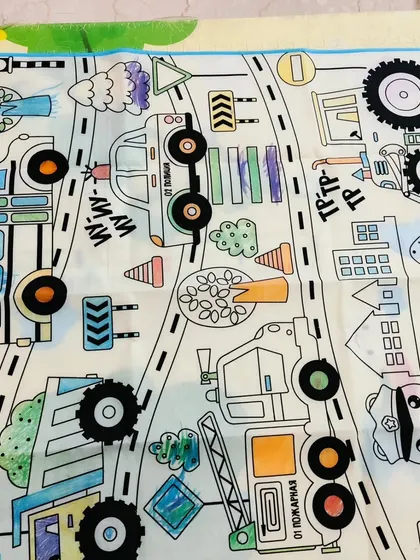 A partially colored mat, showing the fun in progress. The large size allows for hours of creative fun, and it's easy to store away.