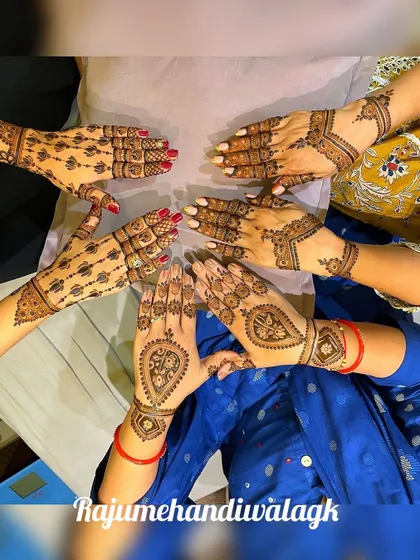 A group of friends or family showing off their festive mehandi. We ensure that even with quick guest designs, each person gets a beautiful and unique pattern.