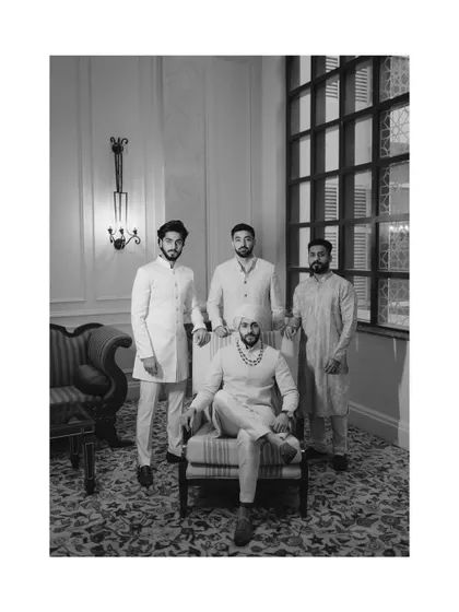 A stylish black and white portrait of the groom and his groomsmen, looking sharp and sophisticated.