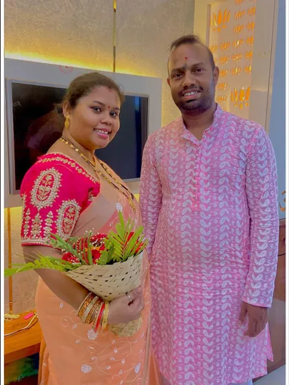 A smiling portrait of our clients, Mr. and Mrs. Sushant, in their new home. Their happiness is a testament to the hard work and dedication of my team.