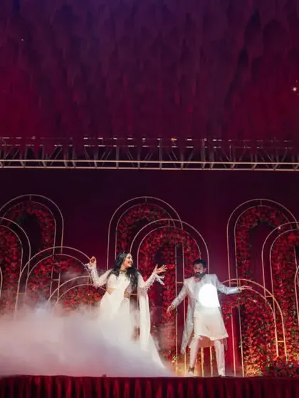 The couple performing their dance on a stage filled with low fog, an effect managed by our technical crew.
