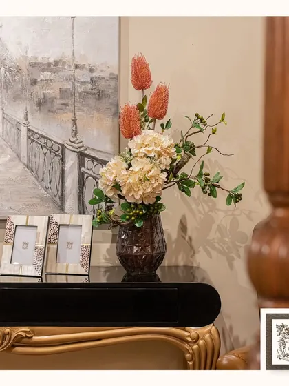 This elegant interior vignette shows how a soft, impressionistic painting of a Parisian street scene can add a touch of romance and sophistication to a console table display.