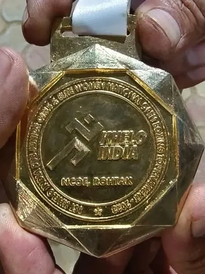 A close up of the gold medal from the Khelo India Sub-Junior Open National Championship. Each medal represents countless hours of training, sparring, and dedication.