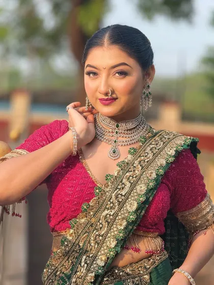 A close-up of the model's elegant look. The hairstyle is simple yet sophisticated, making it a versatile choice for any special occasion.