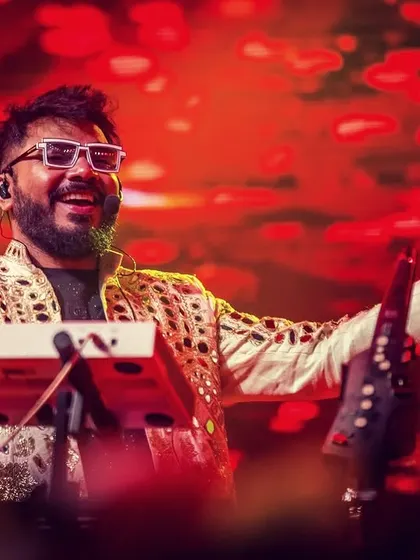 Our keyboardist, with his signature white glasses, enjoying the energy of the crowd at Parab Festival.