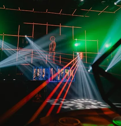 A shot of the stage and light show, framed by a custom 'DS LAND' sign. This shows how we personalize every event, even down to the branding.