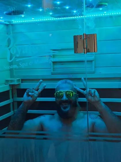 A client flashes a peace sign while enjoying his session. The goal at Salt World is to provide an experience that is not only beneficial for your body but also genuinely enjoyable and uplifting.