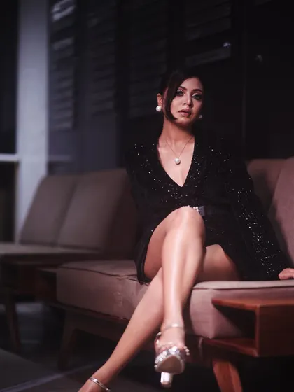 A confident and relaxed pose. This look is perfect for a sophisticated evening event, where you want to look glamorous yet feel comfortable.