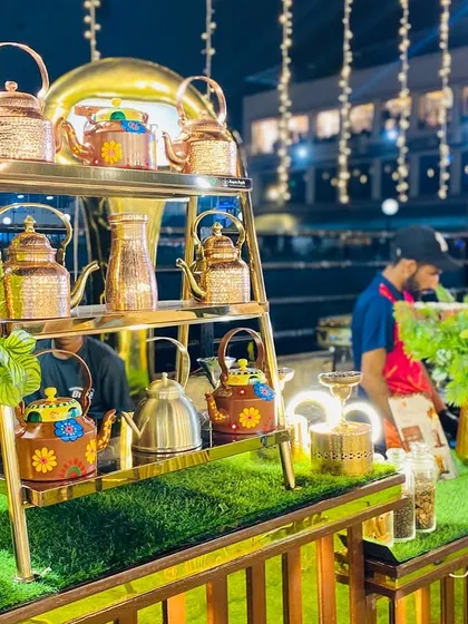A decorative display of traditional tea kettles at our beverage station, adding to the authentic ambiance.
