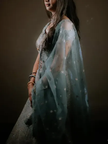 An elegant portrait of the bride at her Sangeet. The soft lighting and her beautiful light blue lehenga create a dreamy and sophisticated look.