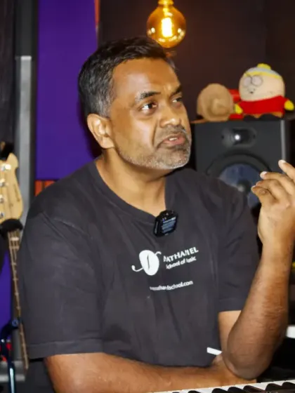 I love these moments of direct interaction during our workshops. Here, I am explaining a music theory concept in our studio. We keep our groups small so I can provide personalized feedback and answer every question.