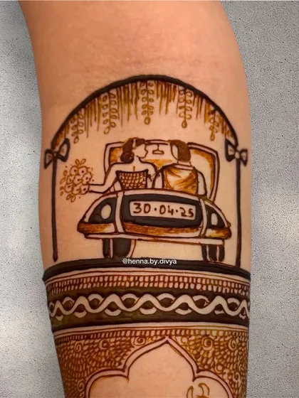 A detailed shot of a custom wedding car portrait on the forearm. This element adds a unique and modern touch to a traditional bridal mehendi design.
