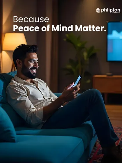Because peace of mind matters. This image of a man relaxing at home, connected and in control via his phone, perfectly captures the ultimate benefit of my smart security systems.