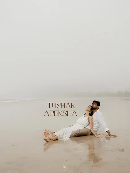 A serene portrait of the couple relaxing on the sand, with their names elegantly scripted. This shot feels like a poster for their own personal love story.