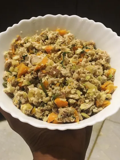 A finished bowl of my chicken and veggie meal. You can see the real chunks of meat and vegetables. No brown pellets, just honest, gently cooked food.