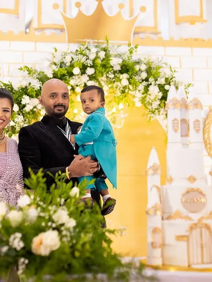 The family gathers around the magnificent castle cake to celebrate a royal first birthday. We coordinate every element, from the cake design to the floral decor, for a cohesive look.