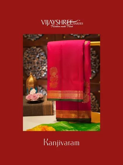 A pink and maroon Kanjivaram with gold zari motifs and a traditional border.
