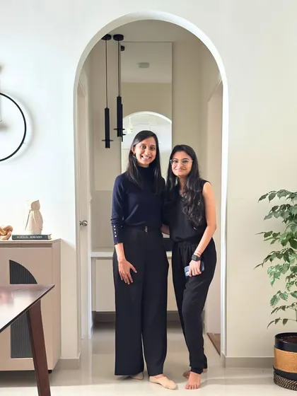 A photo of us, the designers, on-site at a newly completed home. Happy faces in a dream space we brought to life.