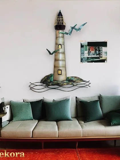 This metal tower wall art is a perfect statement piece for a beach house or a room with a coastal vibe.