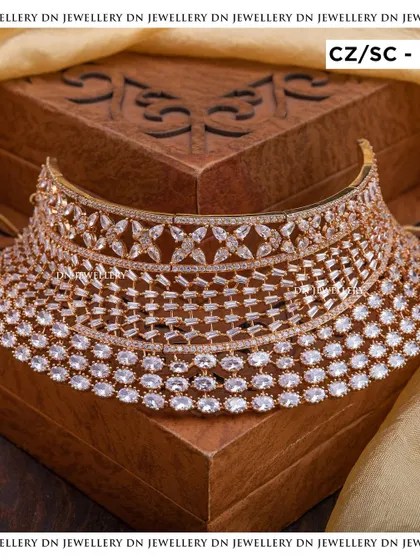 This rose-gold plated CZ choker is a modern and stylish choice. The intricate design gives it a luxurious feel, perfect for a reception or cocktail party.