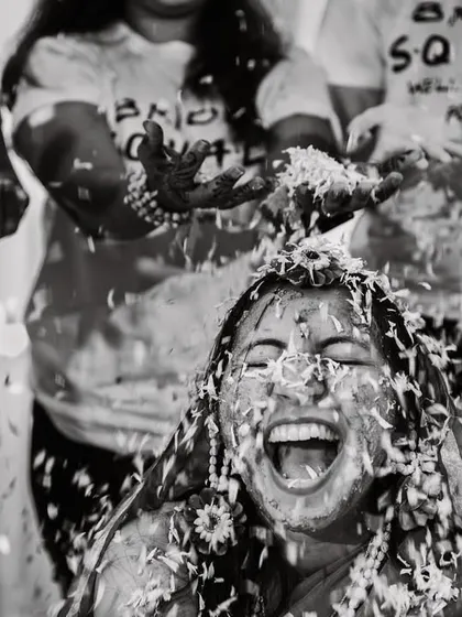 The pure, unfiltered joy of a haldi ceremony. We live for these moments of beautiful chaos, capturing the laughter and celebration with friends and family in timeless black and white.
