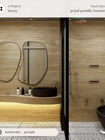 A luxury bathroom for Balwinder in Punjab, featuring wood-plank style tiles, abstract-shaped mirrors, and a freestanding black bathtub for a spa-like, organic modern feel.