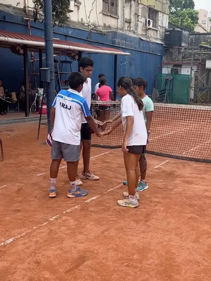 Teamwork and sportsmanship are values we instill from day one. Young players come together after a drill, showcasing the supportive and collaborative environment we foster at our college camps.