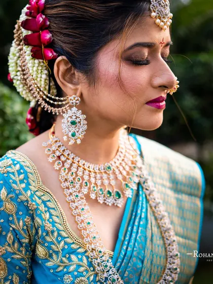 A beautiful South Indian bride I worked with. This look, featuring a classic bridal bun with fresh flowers and diamond jewelry, is a style we teach in our pro course.