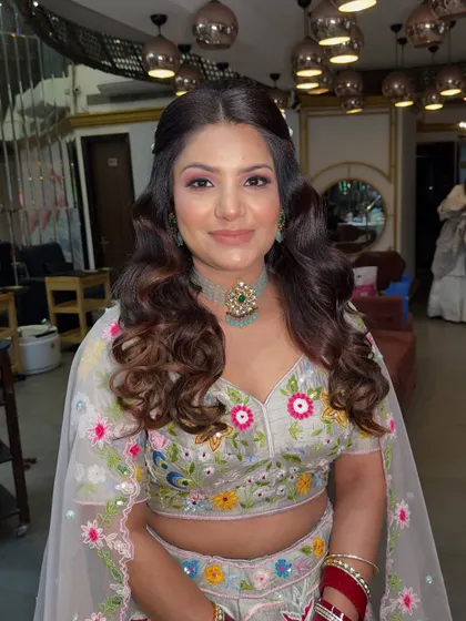 This client is ready for her pre-wedding event in a colorful floral lehenga. I created a fresh, dewy makeup look to match the vibrant and festive feel of her outfit.