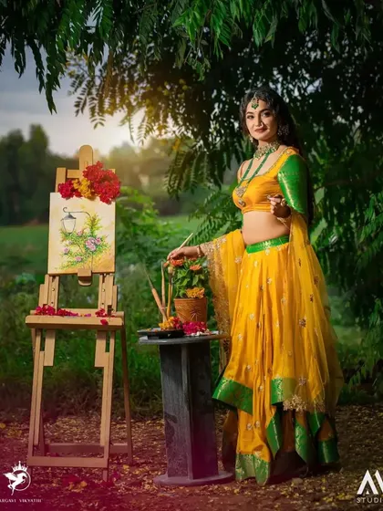 A creative concept shoot featuring our yellow and green lehenga. This outfit is perfect for a Haldi or Mehendi ceremony, and we love creating unique themes like this "artist in the garden" concept.