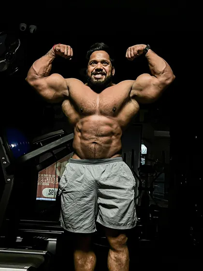 Bodybuilding is a journey. A front double bicep pose.