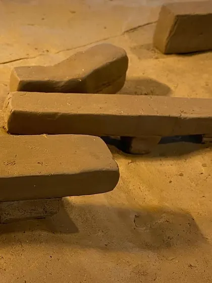 Early clay models exploring form, scale, and the relationship between solid masses. This is a fundamental part of our design process, allowing us to think with our hands and study the play of shadow on simple forms.