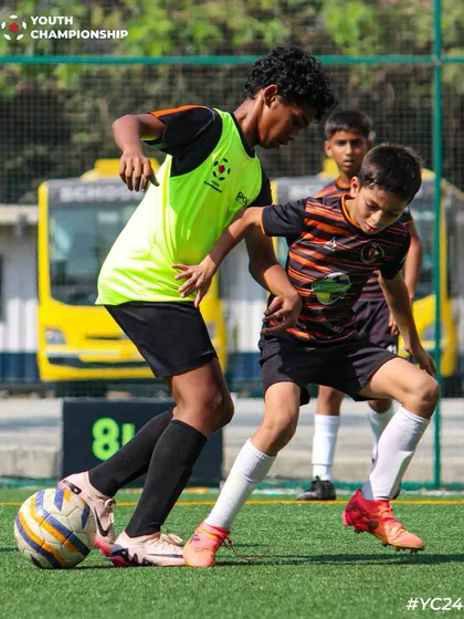 Insane footwork on display as our player maneuvers the ball between two defenders.