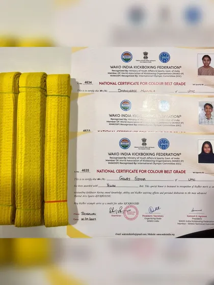 The official WAKO India Kickboxing Federation certificates and yellow belts awarded to our students, a symbol of their hard work and achievement.