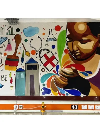 This mural was painted in a children's ward at a hospital with the inspiring message, "You can be whatever you want to be." The artwork is filled with symbols of different professions and dreams.