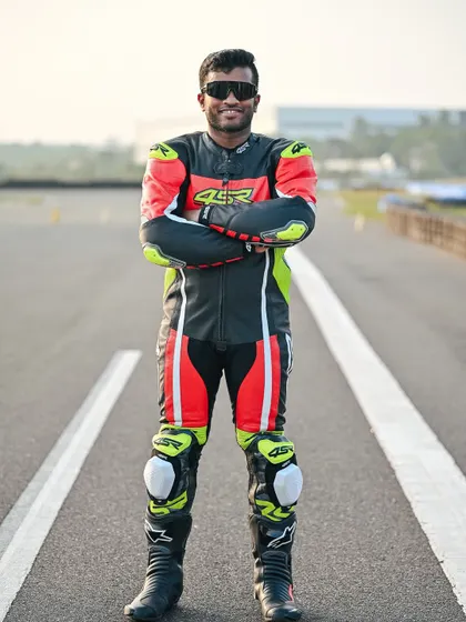 A portrait of Coach Pradeep, a calm and focused presence on our team who is always ready to support and train every rider with genuine care.