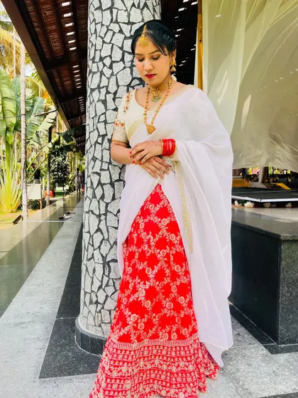 Another shot of the beautiful red and white half saree, perfect for festive occasions.
