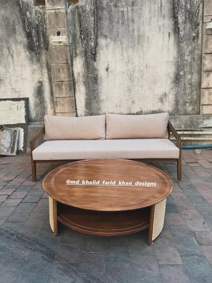 A front view of the round coffee table and sofa.