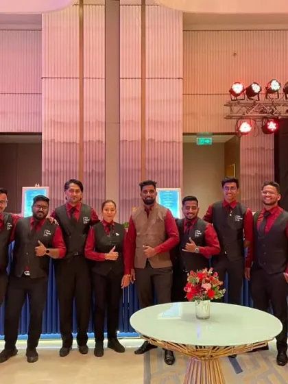 The team gives a thumbs-up at a large wedding reception. We work together to ensure every guest is served efficiently and with a smile.