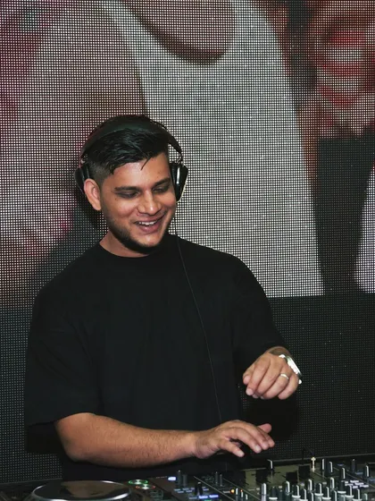 A smiling shot of me at the DJ booth. I'm always happy when I'm surrounded by good music and good people.