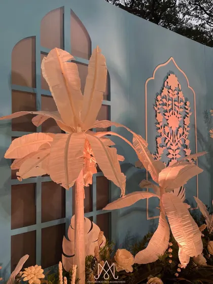 Our own version of the Bar Palladio theme, with custom-made paper palm trees and intricate wall panels creating a unique and artistic photo backdrop.