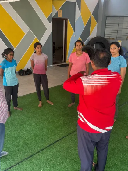 An instructor demonstrates the proper stance and guard to a small group. We ensure everyone gets personal attention to correct their form and build a solid foundation.