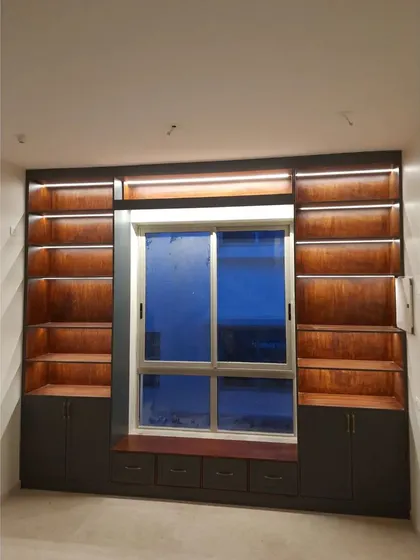 A duplicate of image 206, showing the library unit with its warm, integrated lighting.