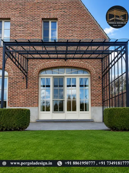 A large glass-roofed conservatory-style pergola against a brick house. The design provides a fully sheltered space that feels like an extension of the interior, perfect for enjoying the garden view year-round.
