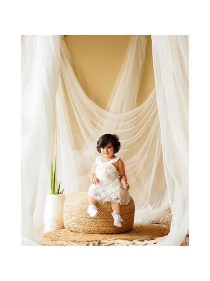 A classic solo portrait of a toddler. Our simple, elegant studio backdrops ensure that your child's personality is the star of the show.