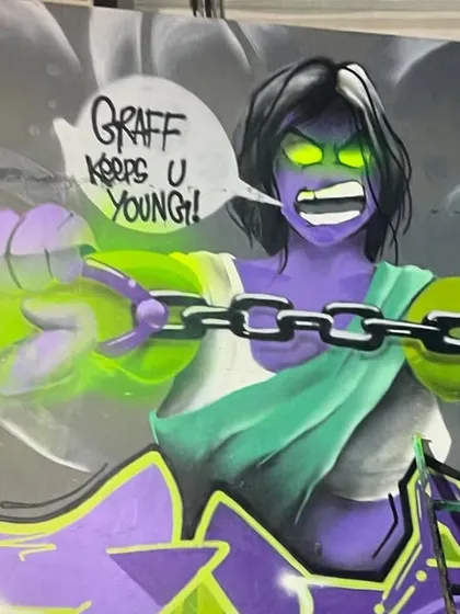A close-up of the character work. The glowing green eyes and chains show the energy I wanted to capture. This is a good example of how I develop characters for large murals.