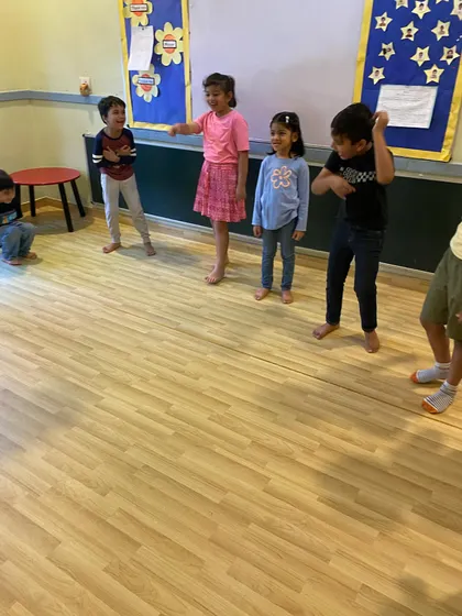 Children engaged in a group activity, learning to work together and express themselves as a team.