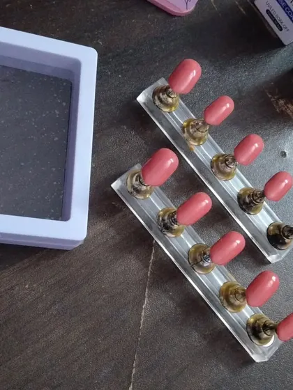 This shows a set of plain, solid-colored nails being prepared for an order. Even my simplest sets are perfectly shaped and finished for a high-quality look.