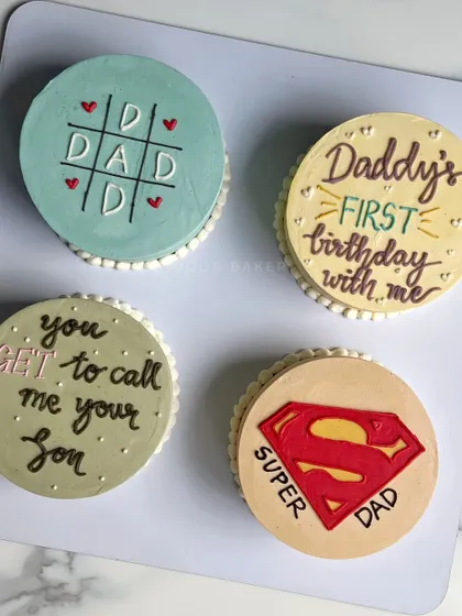 A collection of mini cakes I made for Father's Day. From "Super Dad" to a playful tic-tac-toe design, these cakes are a sweet way to show your appreciation.