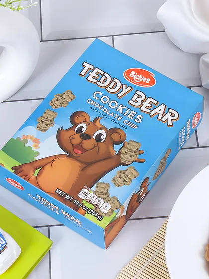 A playful and kid friendly setup for Teddy Bear Cookies. The styling with a toy car and notebook suggests it's a great snack for a child's tiffin box or study time.